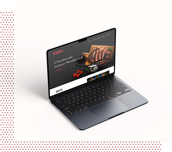 Dynamite Woodfire Grill website design on laptop