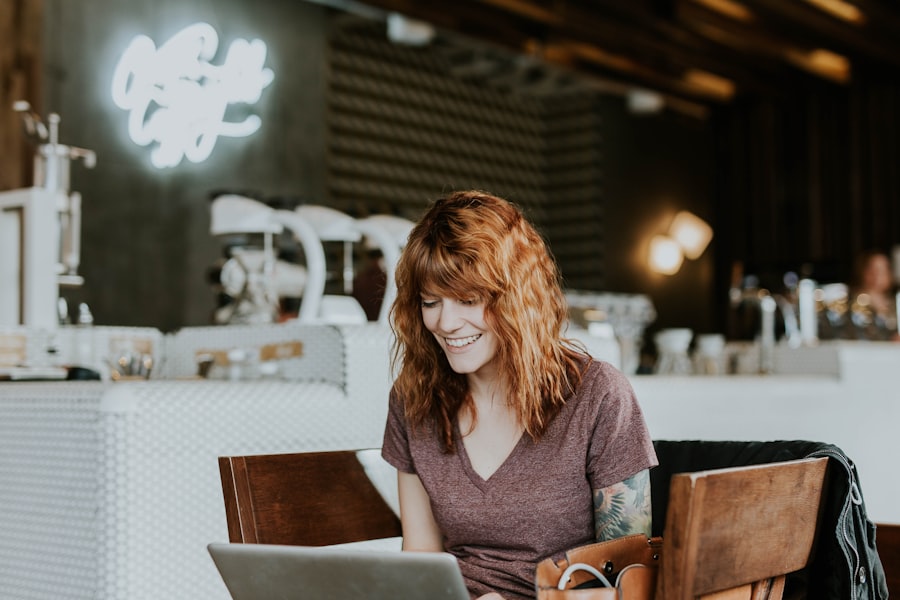 woman working on restaurant site design in cafe